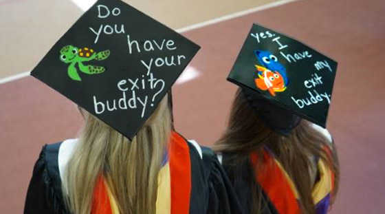 Graduating students with decorated hats